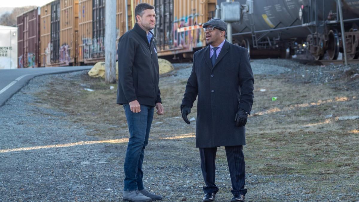 Congressman Pat Ryan and Mayor Harvey of Newburgh next to CSX freight train.