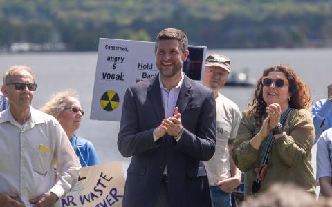 Congressman Ryan applauds as he introduces legislation for clean, air and water for all.